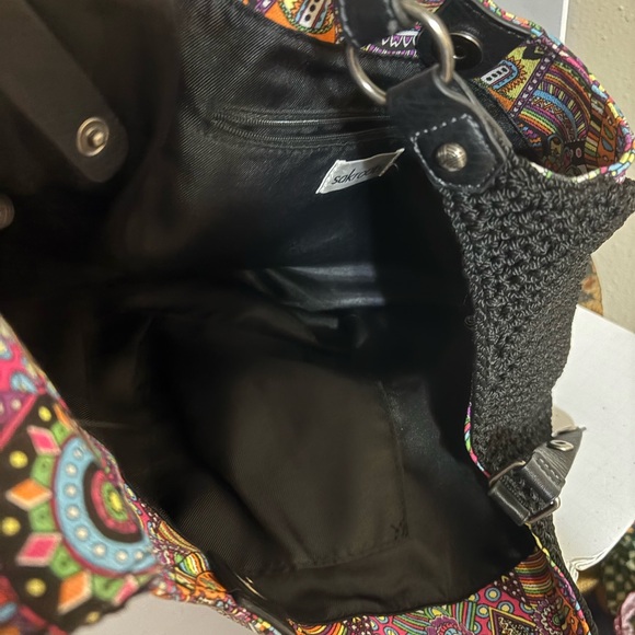 Sakroots bag, characterized by its distinctive bohemian and colorful design. - Picture 7 of 12
